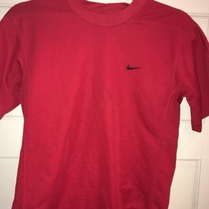 Red Nike athletic dri-fit sports shortsleeve shirt